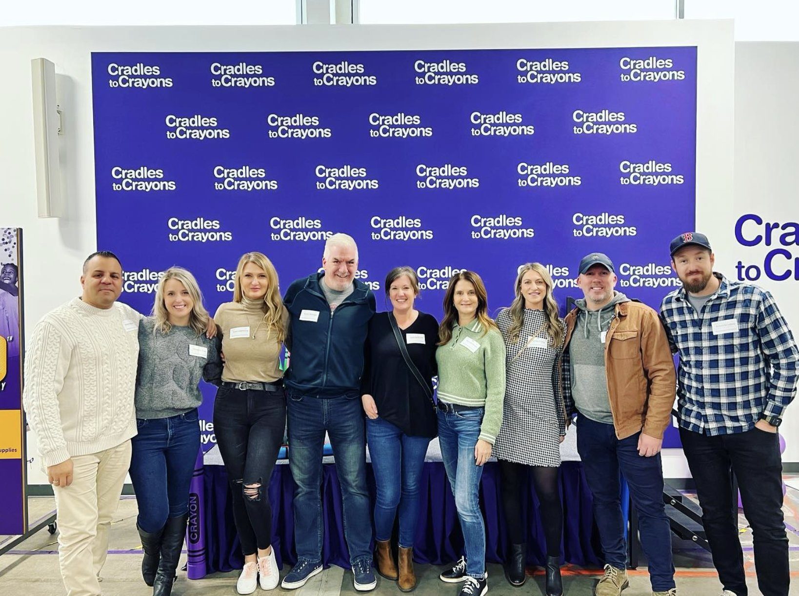 The Warren team volunteering together at Cradles to Crayons