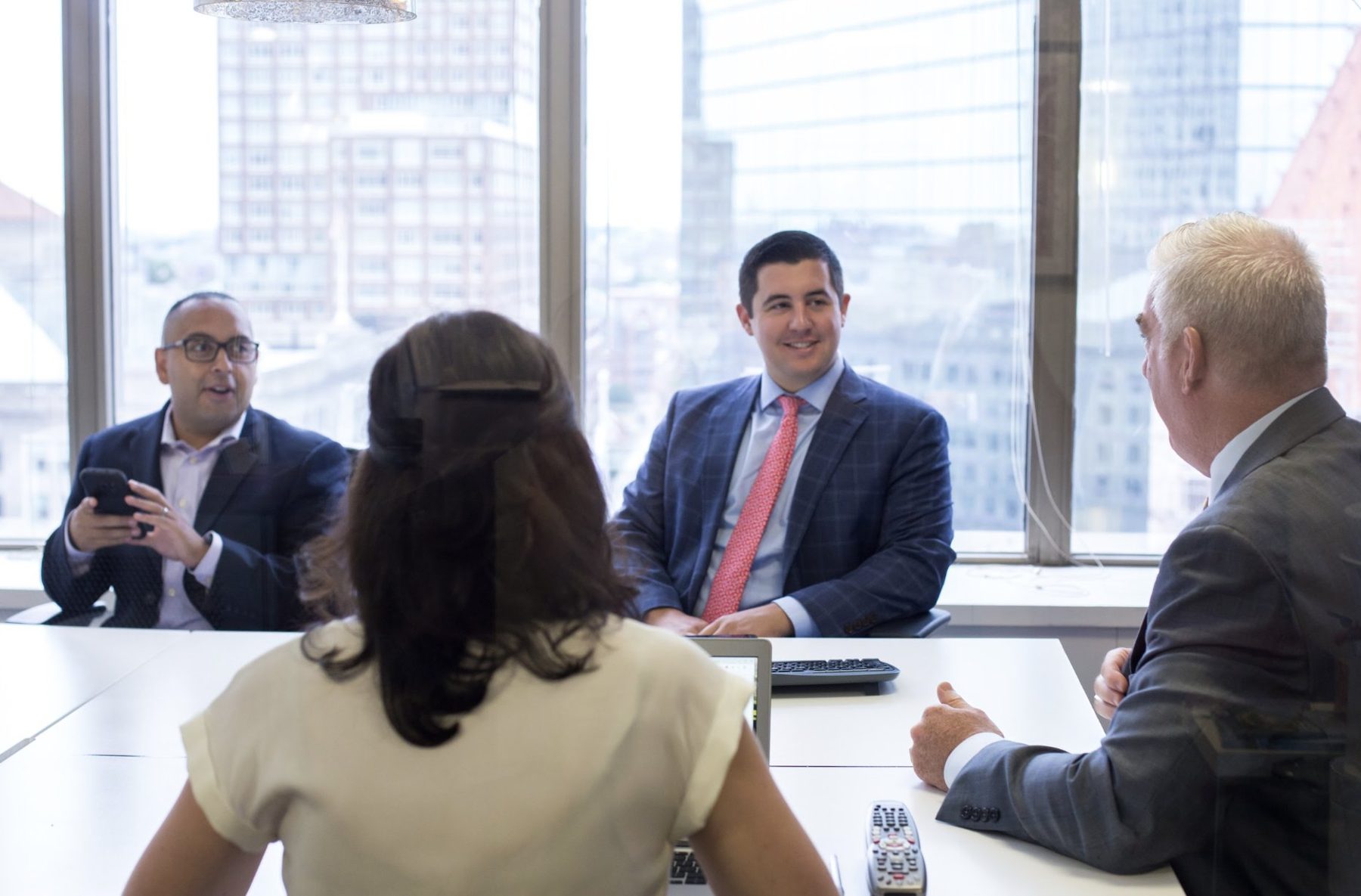 Warren agents in a meeting at the office